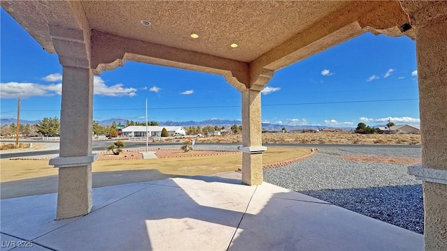 view of patio with a mountain view