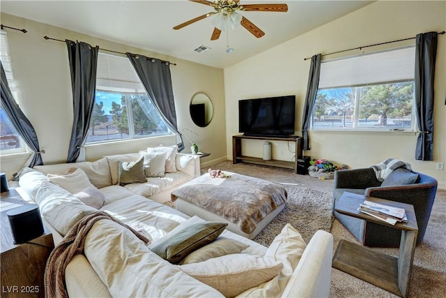 living room with lofted ceiling, light colored carpet, and ceiling fan