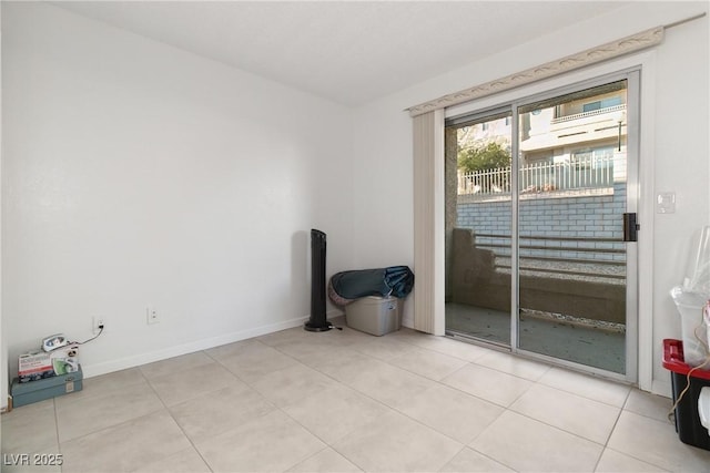 spare room with light tile patterned floors