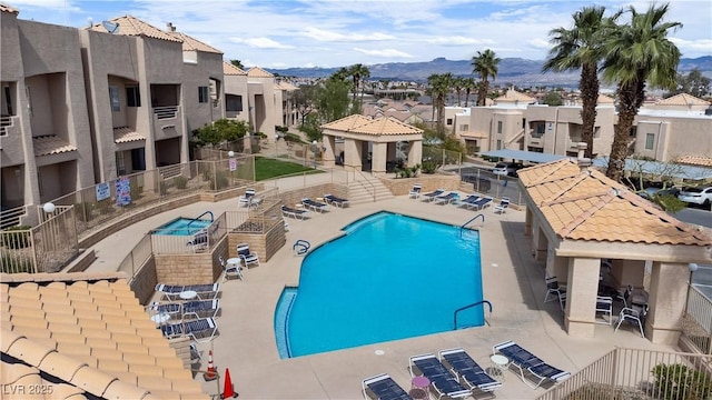 view of pool with a mountain view and a patio area