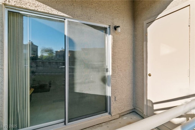 doorway to property featuring a balcony