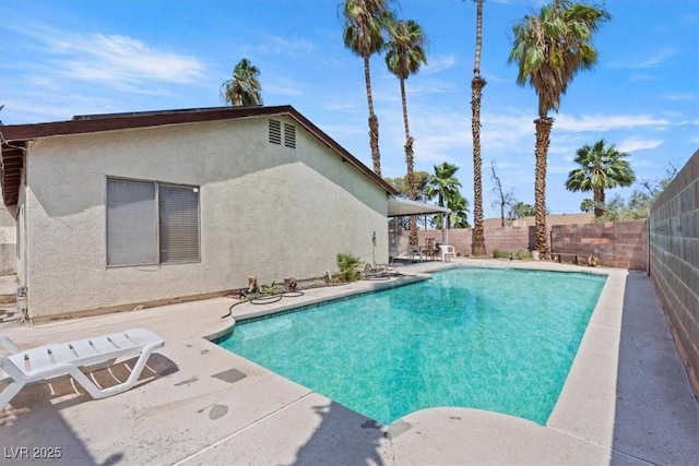 view of swimming pool featuring a patio area, a fenced in pool, and a fenced backyard