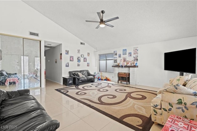 tiled living area with ceiling fan, high vaulted ceiling, visible vents, and a textured ceiling