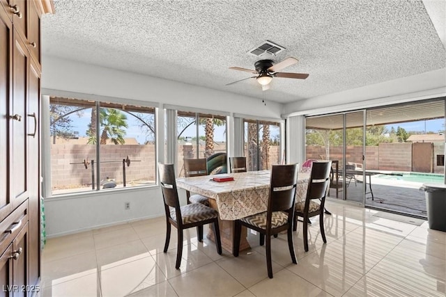 sunroom featuring ceiling fan and visible vents