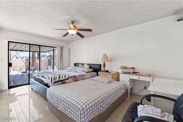 bedroom featuring access to outside, ceiling fan, and a textured ceiling