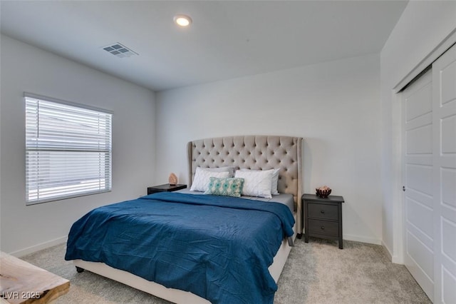 bedroom featuring light carpet