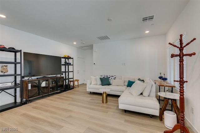 living room with light hardwood / wood-style floors