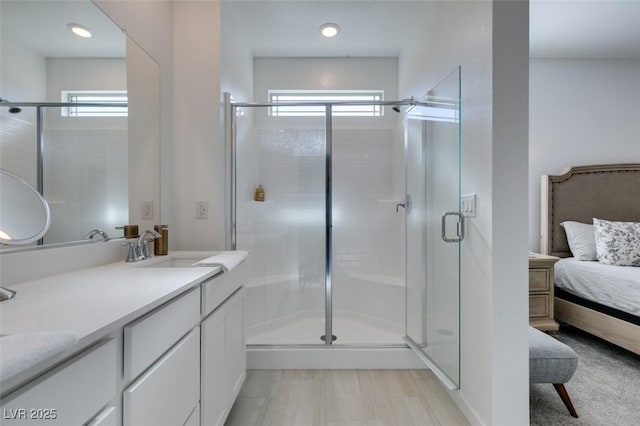 bathroom with vanity, plenty of natural light, and an enclosed shower