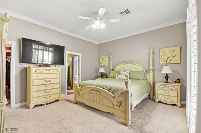 carpeted bedroom featuring connected bathroom, ornamental molding, and ceiling fan