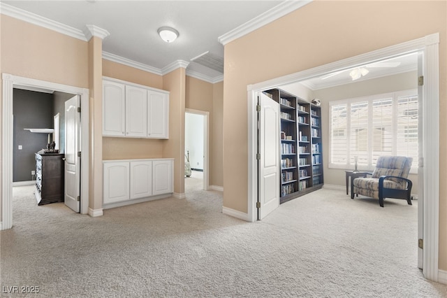 corridor with light carpet and crown molding