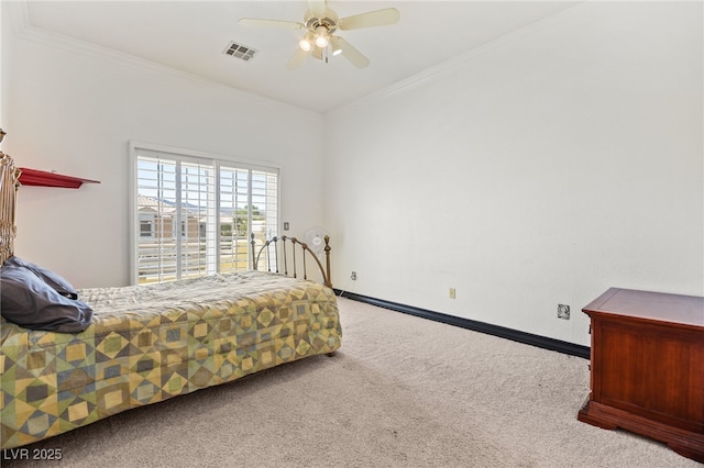 carpeted bedroom with ornamental molding and ceiling fan