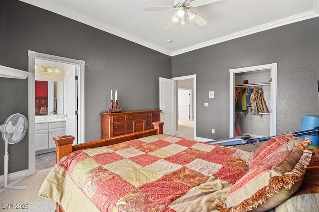 bedroom featuring light carpet, connected bathroom, crown molding, and a closet