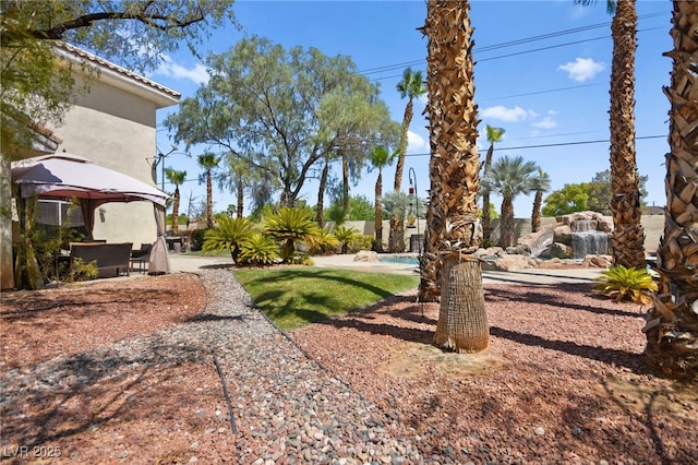 view of yard featuring a gazebo and a patio area