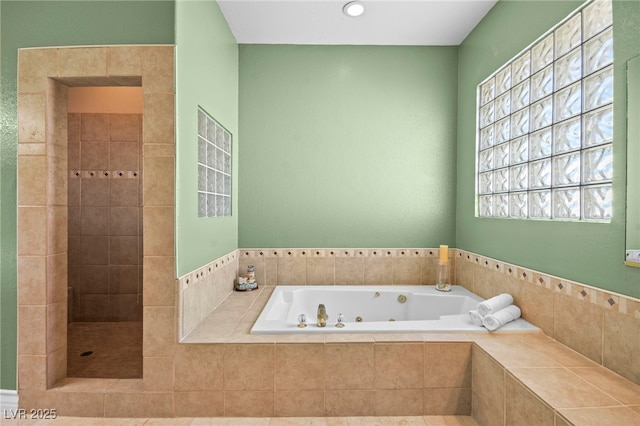 bathroom with separate shower and tub