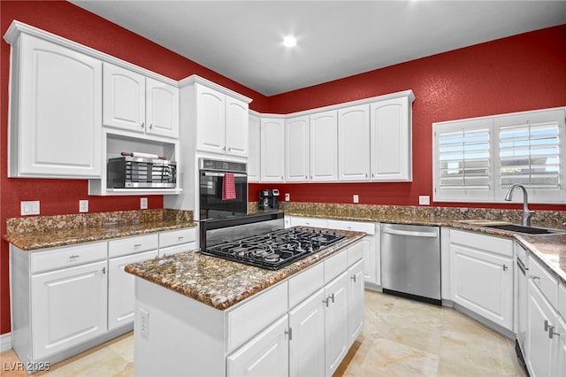 kitchen with sink, stainless steel appliances, and white cabinets