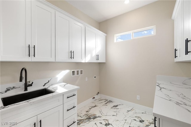 laundry room with electric dryer hookup, sink, washer hookup, and cabinets