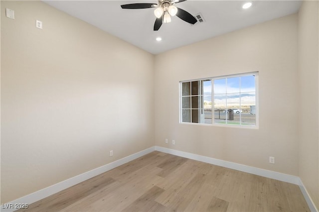 unfurnished room featuring ceiling fan and light wood-type flooring