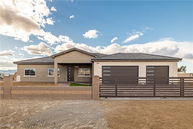 prairie-style home featuring a garage