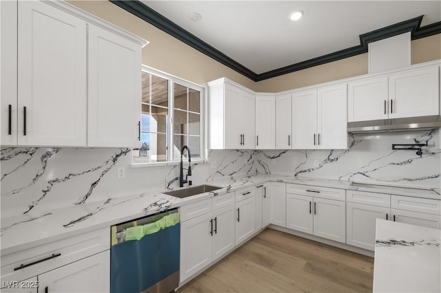 kitchen with sink, ornamental molding, white cabinets, and dishwasher