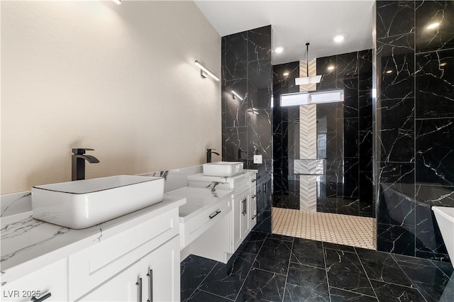 bathroom featuring vanity and tiled shower