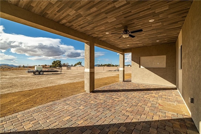 view of patio featuring ceiling fan