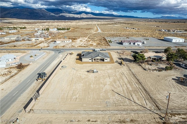 drone / aerial view featuring a mountain view