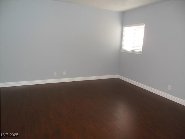 unfurnished room with hardwood / wood-style floors