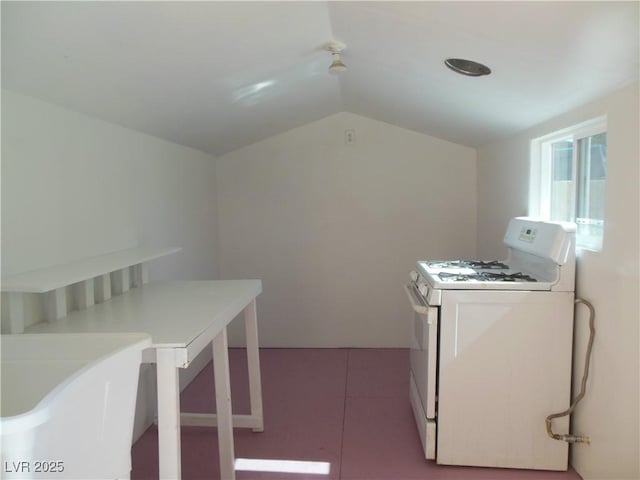 clothes washing area with light tile patterned floors