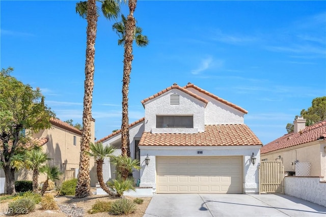 mediterranean / spanish home featuring a garage