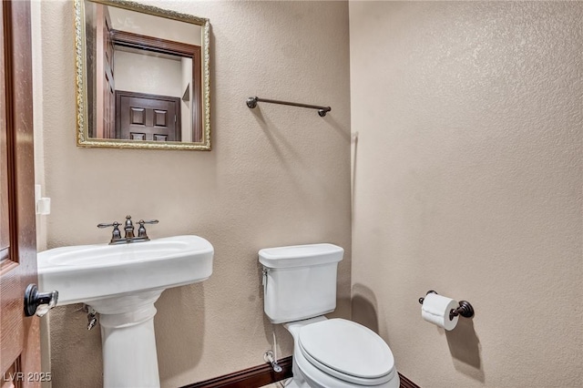 bathroom featuring toilet