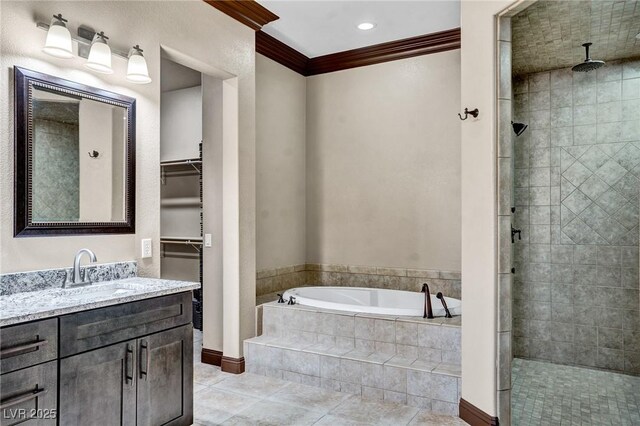 bathroom featuring crown molding, tile patterned floors, independent shower and bath, and vanity