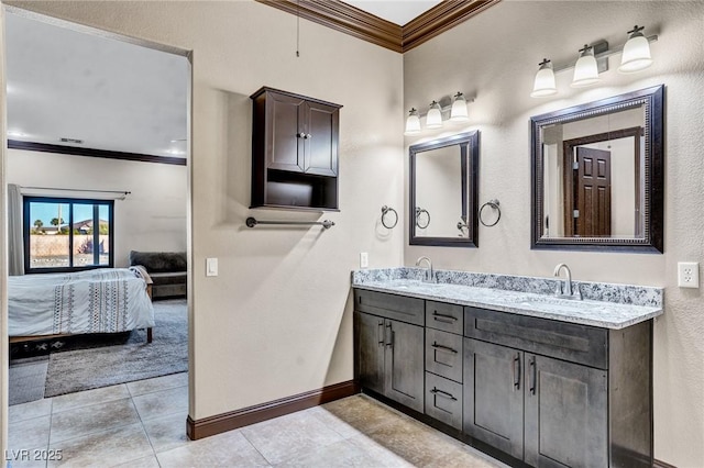 bathroom featuring vanity, tile patterned flooring, and crown molding