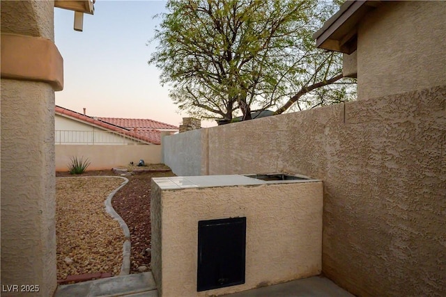 view of patio featuring fence