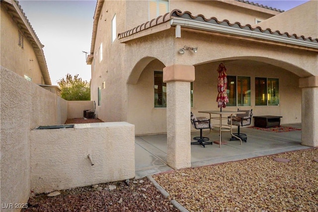 exterior space featuring central AC unit and fence private yard