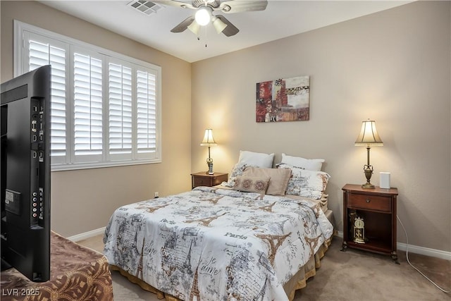 bedroom with a ceiling fan, carpet flooring, visible vents, and baseboards