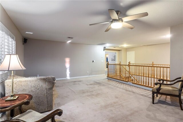 living area with light colored carpet