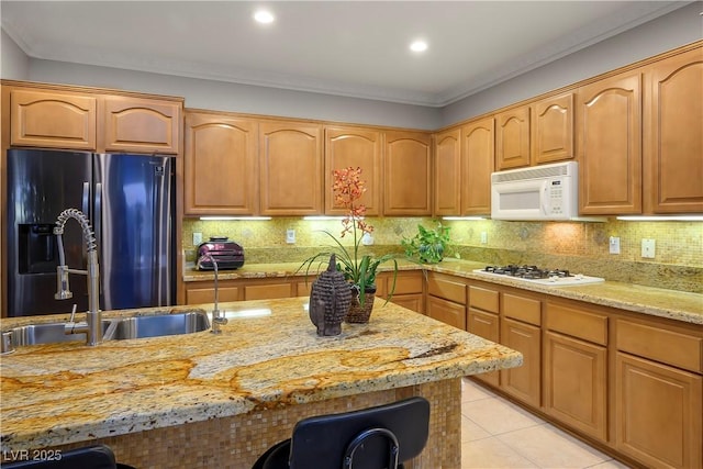 kitchen featuring light stone counters, light tile patterned floors, backsplash, ornamental molding, and white appliances