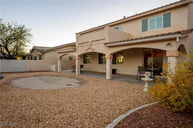 rear view of house with a patio