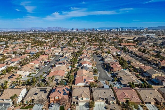 birds eye view of property with a mountain view