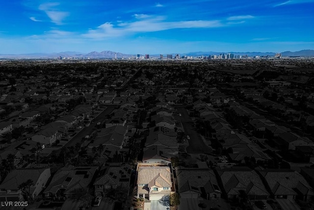 birds eye view of property featuring a view of city and a mountain view