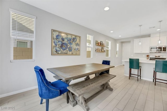 dining area with light wood-type flooring