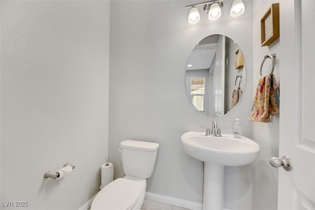 bathroom with toilet and sink