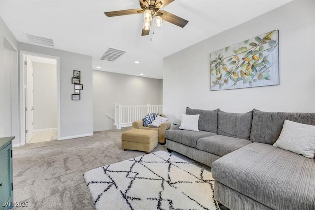 living room featuring carpet floors and ceiling fan