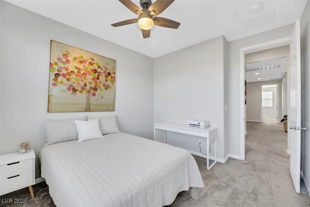 bedroom with ceiling fan and light carpet