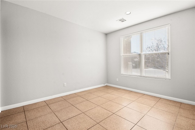 empty room featuring light tile patterned flooring