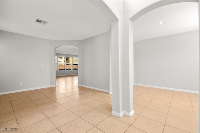 unfurnished room featuring light tile patterned flooring