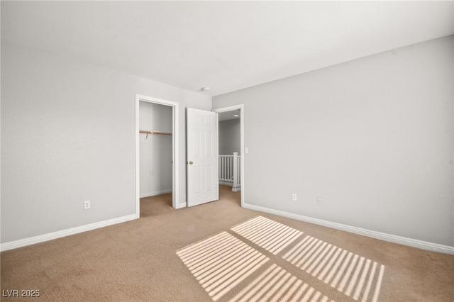 unfurnished bedroom with a closet and light carpet