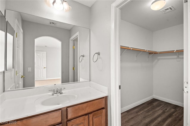 bathroom featuring wood-type flooring and vanity