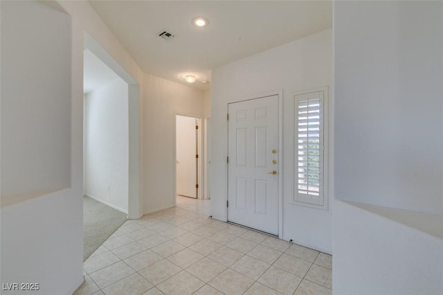 entrance foyer with light tile patterned floors