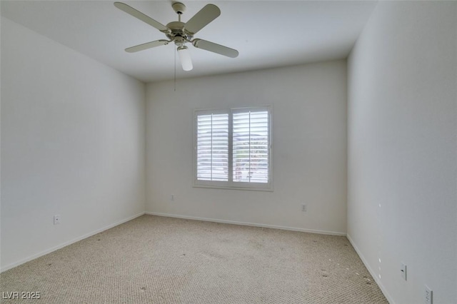 unfurnished room featuring ceiling fan and light colored carpet